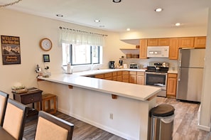 Spacious Kitchen - Recently remodeled kitchen and dining room area. The dining room will easily seat all of the guests and the kitchen is fully equipped.