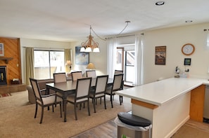 Open Layout of the Kitchen, Dining Area, and Living Room - Recently remodeled kitchen, living room, and dining room area. The dining room will easily seat all of the guests and the kitchen is fully equipped. The living room has two new sofas and one is a sleeper sofa.