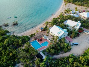 Two Cottages on the Property. Cottage #1 is furthest from the pool to the right.