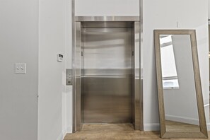 Elevator that opens into unit