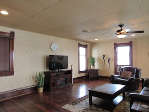 Living room with large flat screen and fireplace cabinet