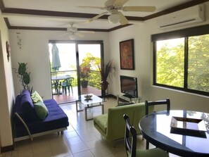 Living and dining area! Deck in the back looking down to the forest and ocean!
