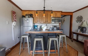 Enjoy your meals at the kitchen island that sits four people.