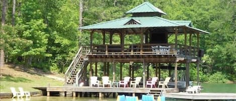 Incredible dock with Upper Deck seating, Bar and 50' TV, steps into water