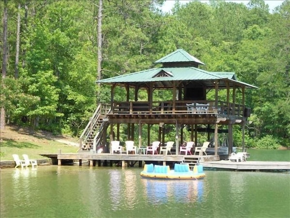 Incredible dock with Upper Deck seating, Bar and 50' TV, steps into water