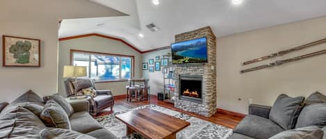 Cozy up around the fire in this comfortable and contemporary living space. Catch up with loved ones or watch a movie on the large mounted HDTV