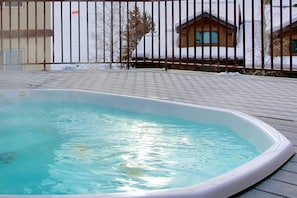 Soak in the community hot tub with great mtn views after a long day.