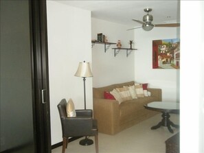 View of den from living room.  Wood sliding door on left closes for privacy