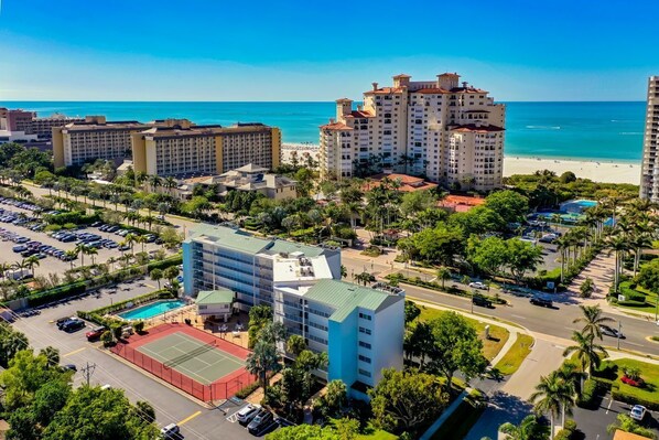 Aerial view of San Marco Residences directly across from beach access and JW Marriott. 