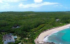 Alfred House and its pool overlooking Casuarina Bay Beach.   The beach is almost always deserted.