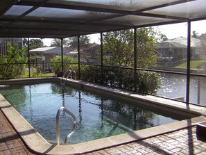 Heated Pool/hot tub with lanai, waterfront, boat dock, massage chair, piano.