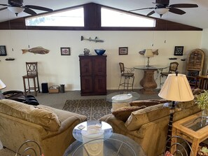 Comfy couches facing entertainment center. 