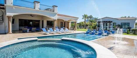Outdoor paradise w/ lounge chairs, pool, spa, splash pad, & games