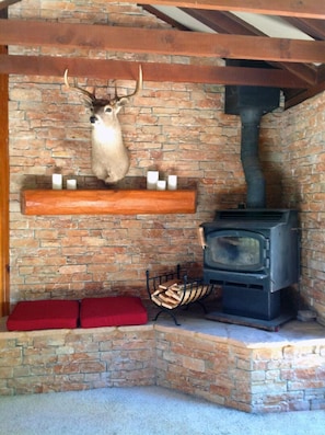 Custom rock fireplace with wood burning stove