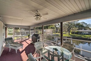 Look out over the canal from the enclosed porch.