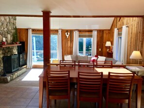 Open floor plan connecting kitchen, dining, and living room. 