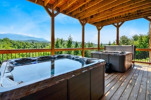 Two hot tubs on the balcony of this Vacation rental near Gatlinburg TN.