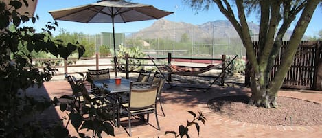 Enjoy your private patio with views of the tennis court and mountains beyond.  