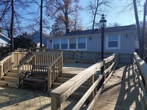 North side facing the lake. Large split level deck w/ ramp access to both levels