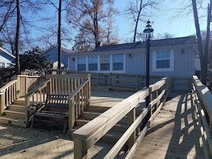North side facing the lake. Large split level deck w/ ramp access to both levels