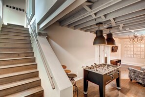 Bottom of Stairs: concrete, steel, wood —fun industrial design in this 1894 home