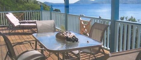 panoramic bay view covered deck patio with outside dining area