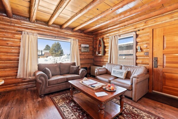 Nestle into the inviting living room seating area, where plush cushions and stylish furnishings create the perfect space for relaxation and conversation.