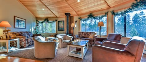 Warm cedar ceiling adds to the ambiance. Along with sunny meadow and tree views.