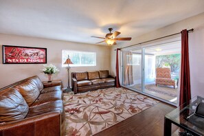 Luxury seating with flat screen TV and patio/poo access