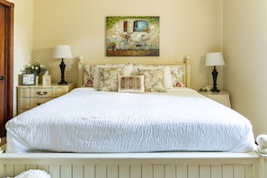 King bedroom with door to the left leading directly to the guest bathroom.