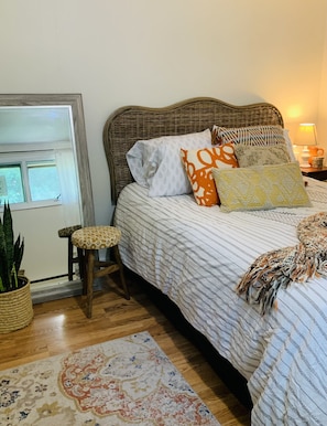 The back bedroom has a lovely queen bed and a very friendly giant mirror.