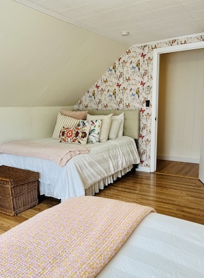 The L shaped front bedroom leaves plenty of room for a full and queen size bed.