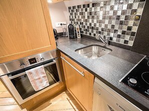 Kitchen- built-in fridge, Bosch convection oven, microwave, electric cooktop