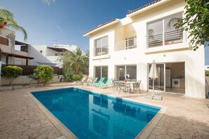 Garden with barbecue, seating area, sun loungers and private pool