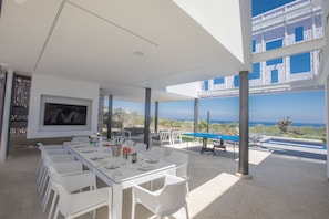 Outside dining Area that includes a widescreen TV