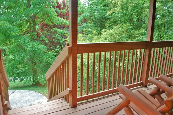 Sit on our rockers and view mountaintops and treetops from our front deck. 