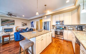Gleaming chef’s kitchen with island seating
