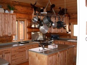 Kitchen with professional applicances and cookware