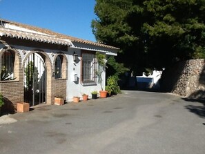 Front entrance and quiet court yard area leading to road entrance.