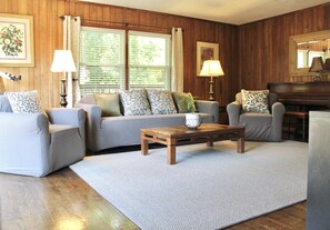 Living room is spacious and comfortable with smart TV, piano, games, puzzles