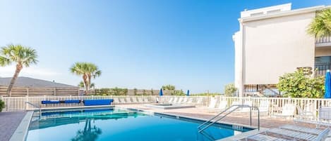 Relax at the pool, adjacent to the beach.