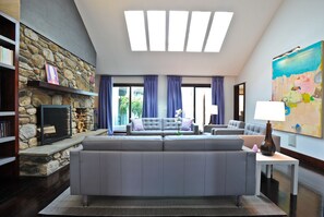 Art Filled Living Room - Fire Place - Vaulted Ceiling