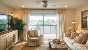 Your view from the Dining Table looking out to the balcony past the living area offers the feeling of comfort and scenery created here for your stay.