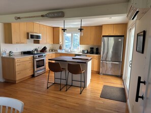 New Kitchen Island - more counter space, storage and waste cabinets.