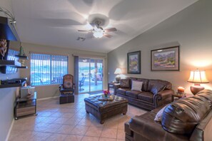 Great room has doors to the back patio and is a comfortable place to relax with your favorite people.