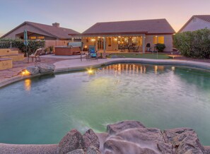 Lagoon pool with option to heat invites you for sunlit or star-studded dips in enclosed backyard.