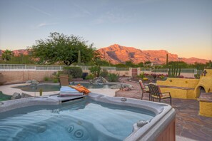 Hot tub with mountain views offers a romantic extravaganza.