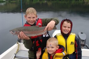 Trout are caught by boat, kayak, or from the shore