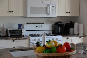 Fully appliance kitchen with microwave and dishwasher