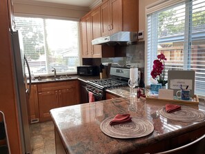 Kitchen w/extended countertop for eating or working.